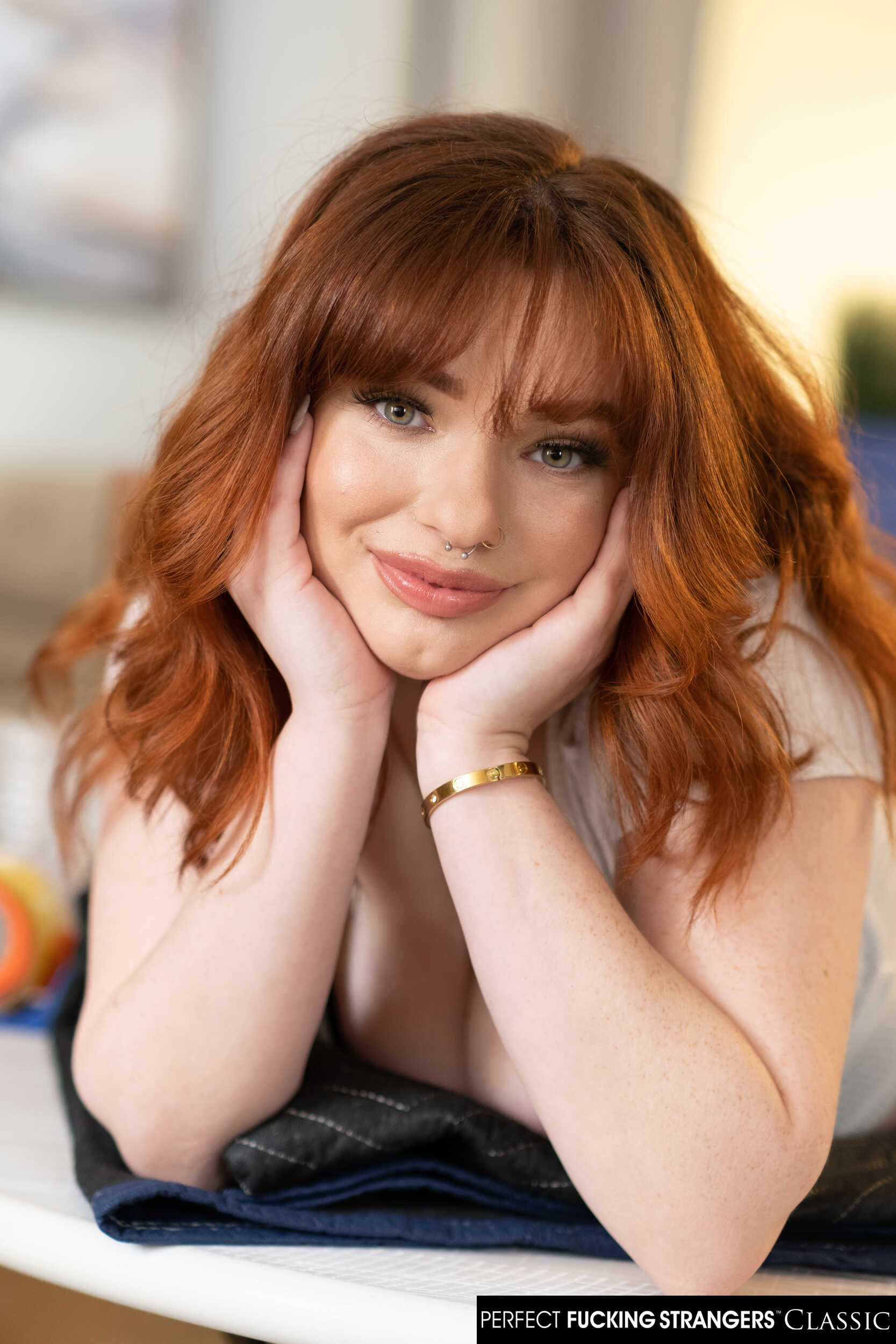 Sexy red head Annabel Redd makes her big natural boobs bounce