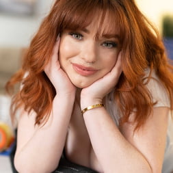 Sexy red head Annabel Redd makes her big natural boobs bounce